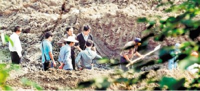 绍兴一别墅园挖出古墓 专家推测是越国王侯墓葬